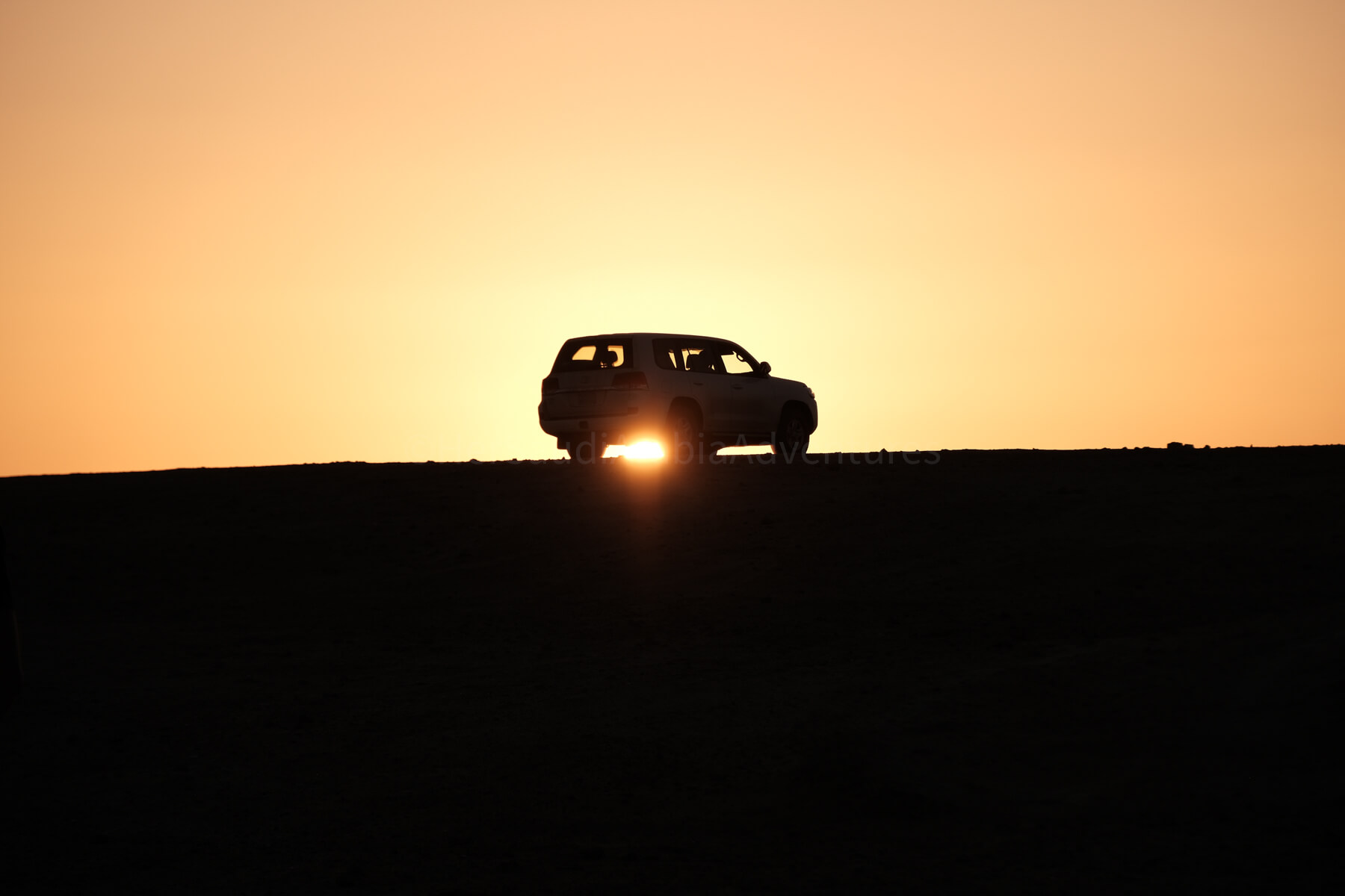 car silhouette sunset